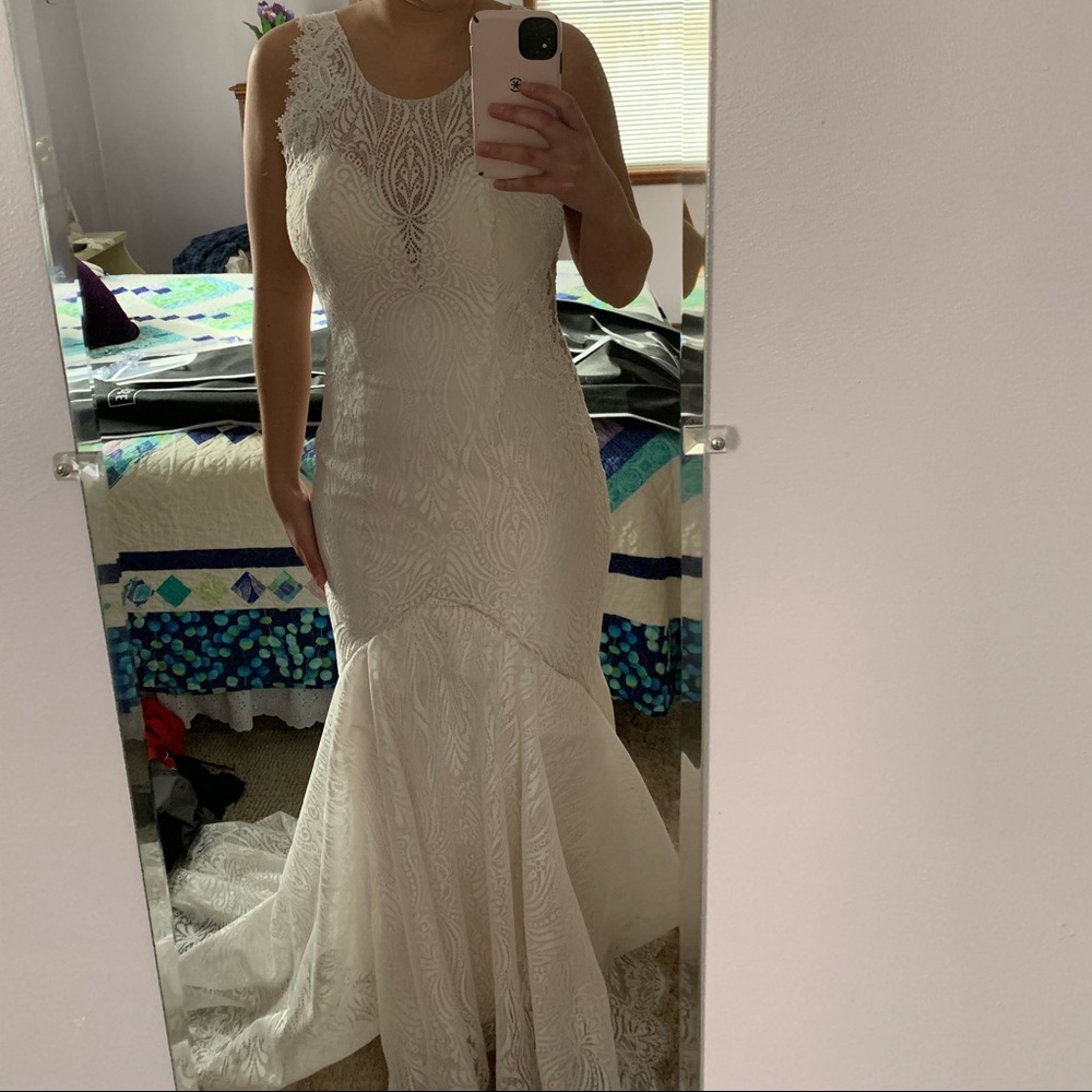 Size 6 wedding dress, only altered never worn.